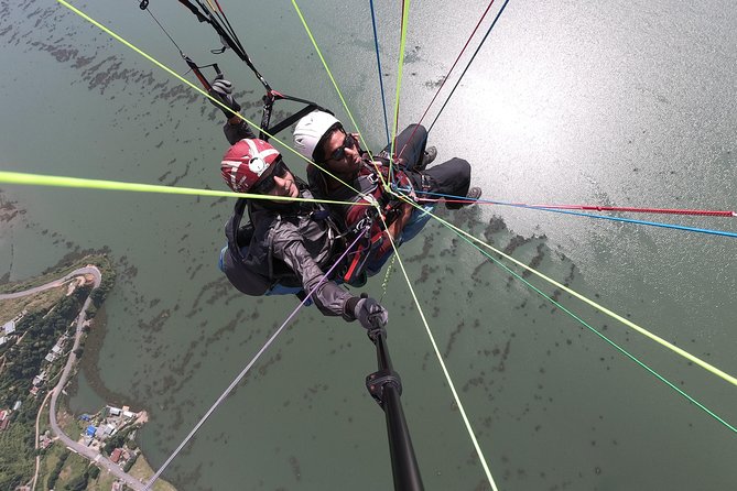 Paragliding - Tour flow: office form, van to Toripani, flight with professionals, then back to your hotel