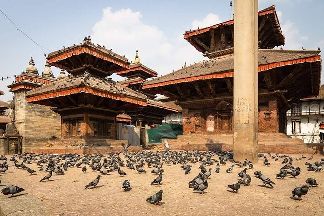 Private Tour of 4 UNESCO Heritage Sites in Kathmandu by Car - Stop 2: Swayambhunath monkey temple, hilltop views, and temple rhythm